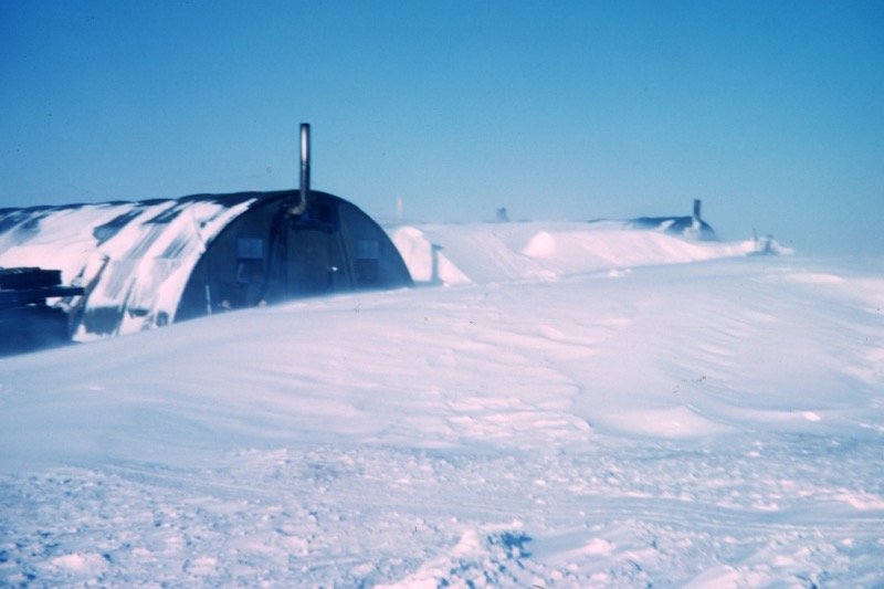 A camp buried in snowdrifts after a blizzard on Alaska's North Slope